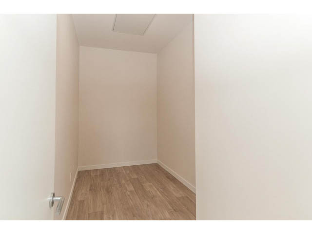 Bright den with hardwood floors and white walls. - 402 - 625 East 3rd Street, North Vancouver