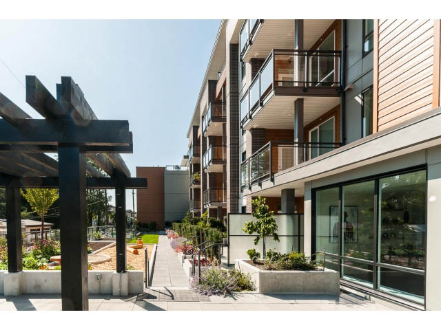 Penthouse with modern design, large windows, and outdoor garden space. - 402 - 625 East 3rd Street, North Vancouver