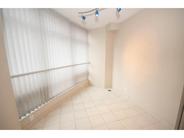 Bright living room with tiled floors and large windows. - 1506 - 1200 Alberni Street, Vancouver Downtown