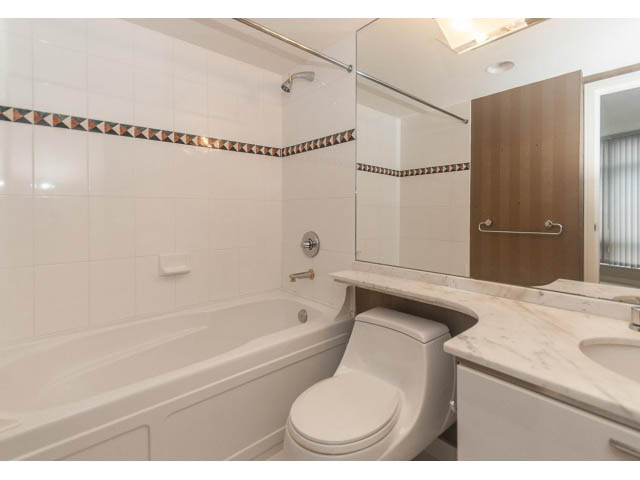 Bright bathroom with white marble countertop and modern fixtures. - 1506 - 1200 Alberni Street, Vancouver Downtown