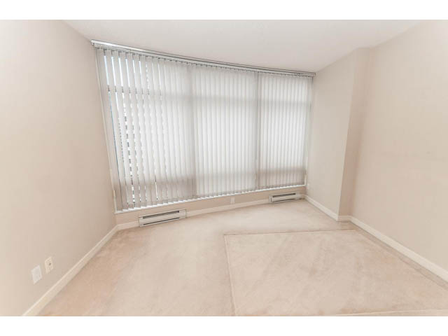Bright bedroom with beige carpet and white blinds covering the window. - 1506 - 1200 Alberni Street, Vancouver Downtown