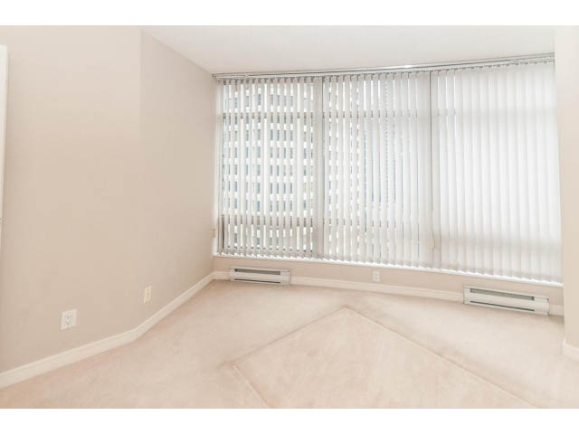Bright living room with large windows and white blinds, neutral tones. - 1506 - 1200 Alberni Street, Vancouver Downtown