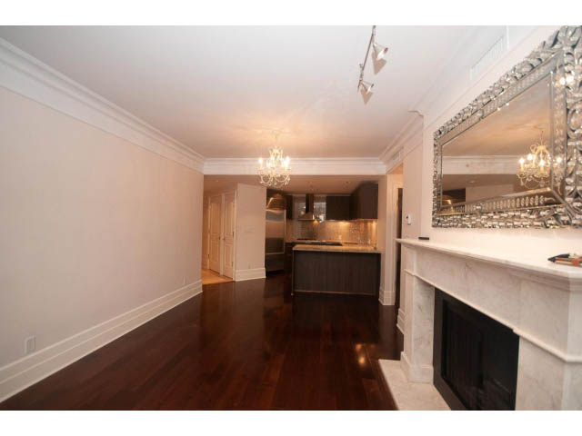 Spacious kitchen with marble countertops and hardwood floors. - 104 - 533  Waters Edge Cres, West Vancouver