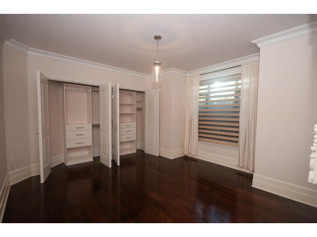 Spacious living room with hardwood floors and a large window. - 104 - 533  Waters Edge Cres, West Vancouver