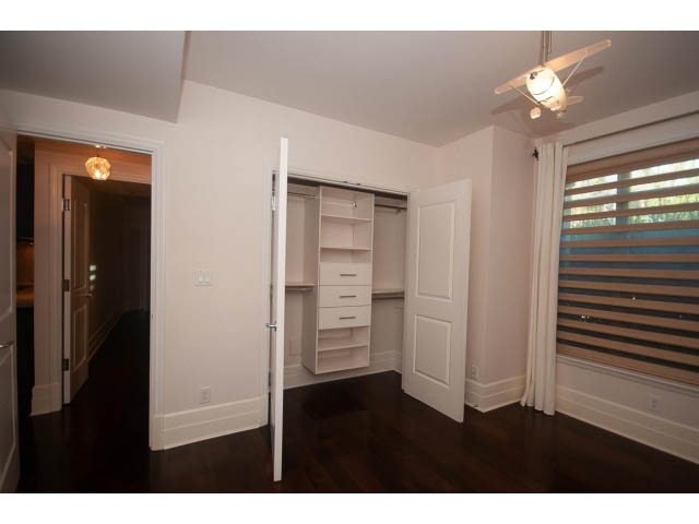 Bright bedroom with built-in closet and hardwood floors. - 104 - 533  Waters Edge Cres, West Vancouver