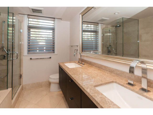 Spacious bathroom with marble countertops and a walk-in shower. - 104 - 533  Waters Edge Cres, West Vancouver
