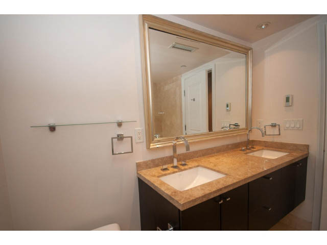 Bathroom with granite countertop and dark cabinetry. - 104 - 533  Waters Edge Cres, West Vancouver