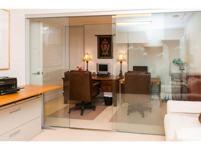 Furnished living room with glass partition, modern furniture, and city view. - 1602 - 667 Howe Street, Vancouver Downtown