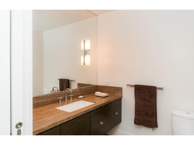 Furnished bathroom with wooden countertops and modern lighting. - 1602 - 667 Howe Street, Vancouver Downtown