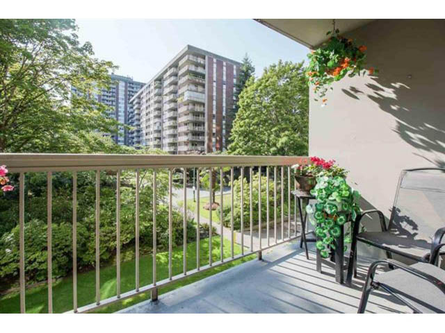 Furnished balcony with greenery and city view. - 309 - 2008 Fullerton Avenue, North Vancouver
