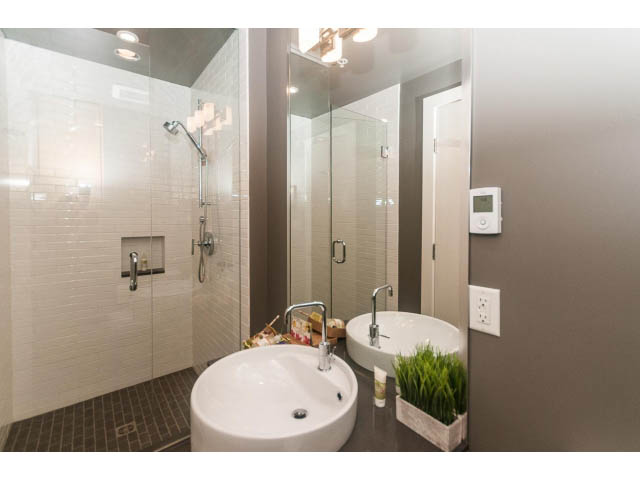Furnished bathroom with modern sink, glass shower, and sleek countertop. - 501 - 1072 Hamilton Street, Vancouver Downtown
