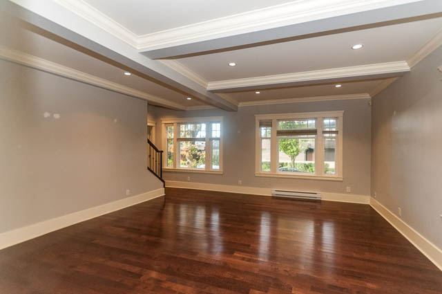 Spacious living room with hardwood floors and large windows. - 196 W 18th Avenue, Vancouver West Side