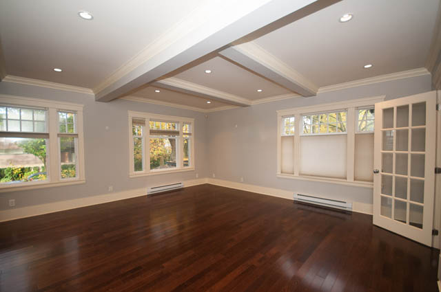 Spacious living room with coffered ceiling, hardwood floors, and large windows. - 196 W 18th Avenue, Vancouver West Side