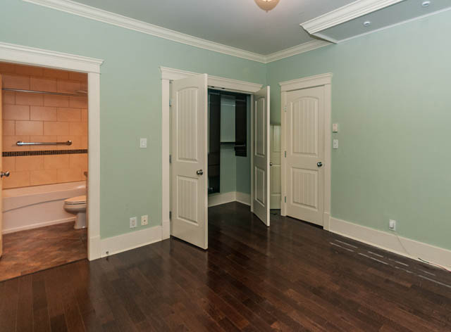 Open den with hardwood floors and a partially open door leading to another room. - 196 W 18th Avenue, Vancouver West Side