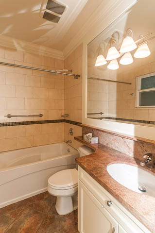 Bathroom with granite countertop and modern lighting fixtures. - 196 W 18th Avenue, Vancouver West Side