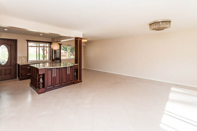 Bright kitchen with granite countertops and hardwood floors. - UPPER - 630 East 29th Street, North Vancouver