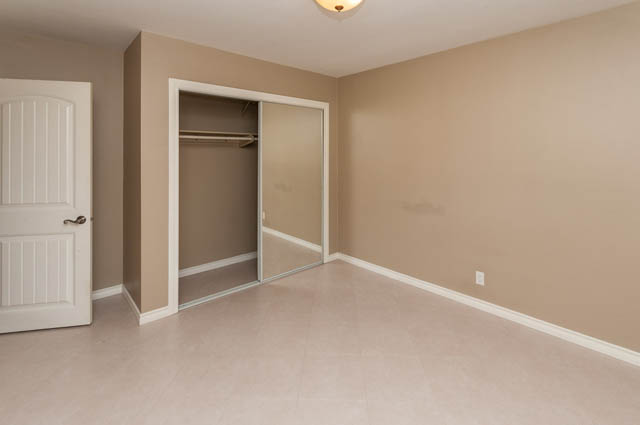 Spacious closet with sliding doors and built-in shelves. - UPPER - 630 East 29th Street, North Vancouver