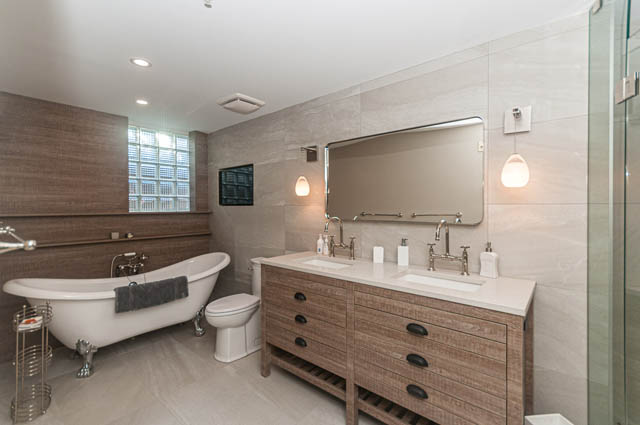 Spacious bathroom with modern fixtures, large mirror, and wooden accents. - PH7 - 1688 Robson Street, Vancouver Downtown