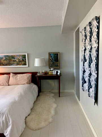 Spacious bedroom with white walls, hardwood floors, and a cozy rug. - 850 E 23rd Avenue, Vancouver East Side