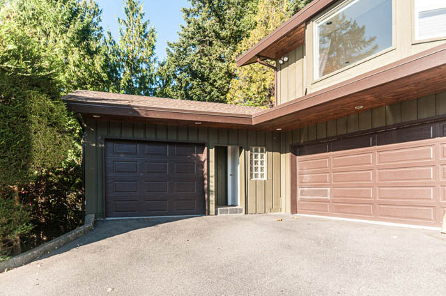 Furnished 5-bedroom house with large garage and trees in the background. - 3399 Thompson Cres., West Vancouver