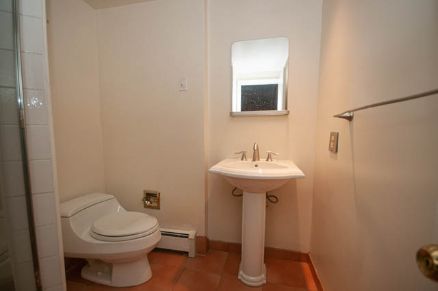 Small bathroom with white fixtures and a window. - 3399 Thompson Cres., West Vancouver