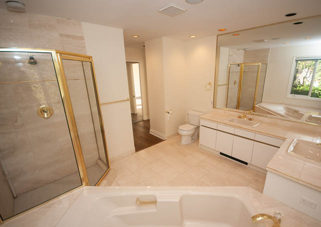 Spacious bathroom with marble countertops and a large shower. - 3399 Thompson Cres., West Vancouver