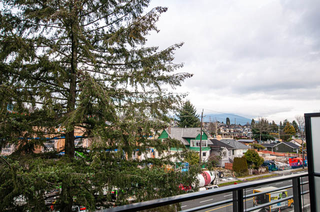 Penthouse with city view and lush greenery. - 404 - 733 E 3rd St, North Vancouver