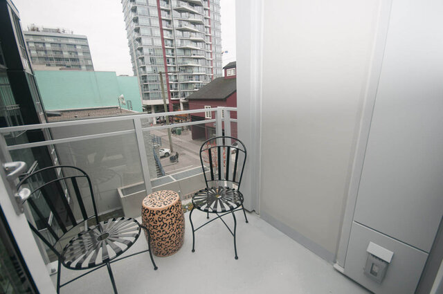 Spacious balcony with modern chairs and city views, perfect for relaxing. - 401 - 1708 Ontario Street, Vancouver West Side