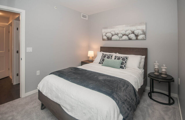 Spacious 1-bedroom + den with cozy bed, modern decor, and a serene neutral color palette. - 401 - 1708 Ontario Street, Vancouver West Side