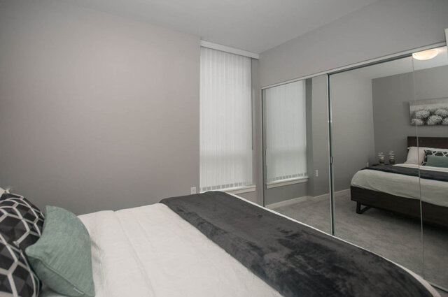 Spacious 1-bedroom + den with modern furnishings, large mirrored closet, and cozy bedding. - 401 - 1708 Ontario Street, Vancouver West Side