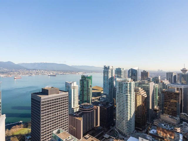 Bright living room with city view and modern furnishings. - 2407 - 1189 Melville Street, Vancouver Downtown