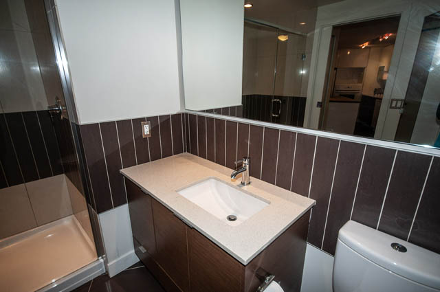 Furnished bathroom with modern countertop and sleek mirror. - 1001 - 175 West 2nd Street, North Vancouver