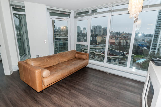 Furnished living room with hardwood floors and city view. - 1001 - 175 West 2nd Street, North Vancouver