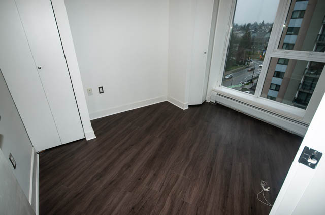 Bright living room with hardwood floors and city view. - 1001 - 175 West 2nd Street, North Vancouver