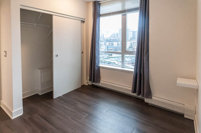 Bright bedroom with hardwood floors and city view. - 1001 - 175 West 2nd Street, North Vancouver
