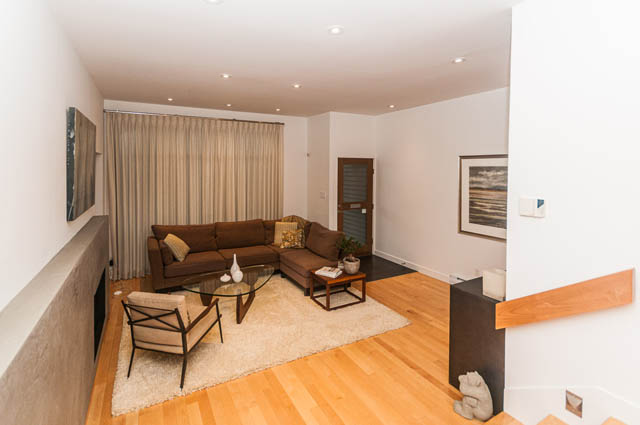 Furnished living room with hardwood floors and modern decor. - 1964 W 15th Ave, Vancouver West Side