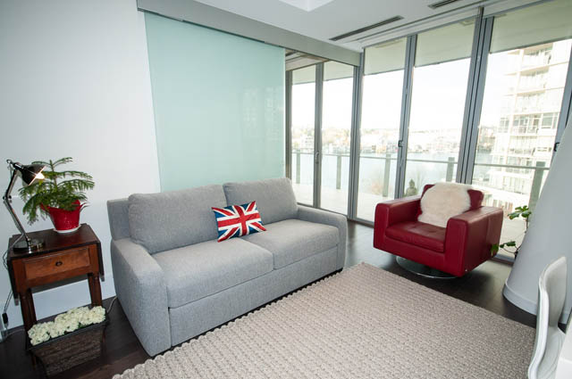 Spacious living room with city view and modern furniture. - 601 - 1560 Homer Mews, Vancouver Downtown