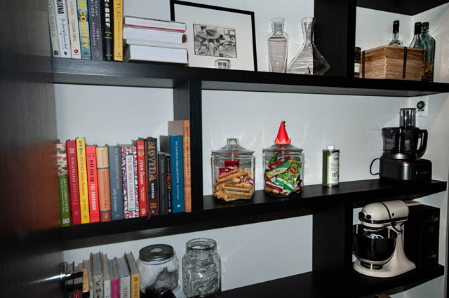 Bright kitchen with open shelving, books, and kitchen appliances. - 601 - 1560 Homer Mews, Vancouver Downtown