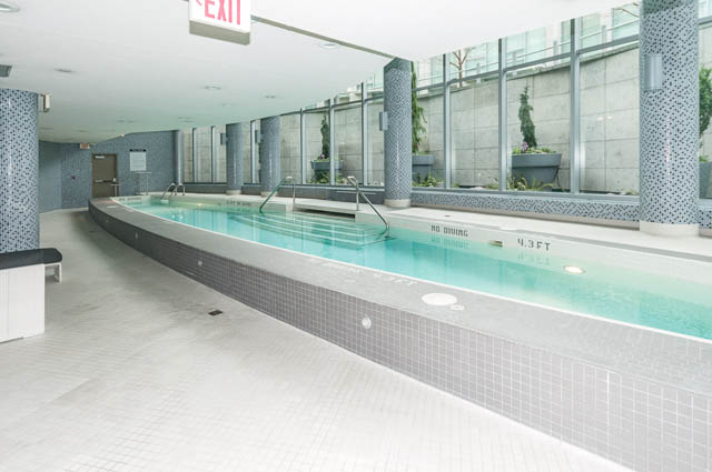 Spacious indoor pool with tiled walls and floor, modern design. - 601 - 1560 Homer Mews, Vancouver Downtown