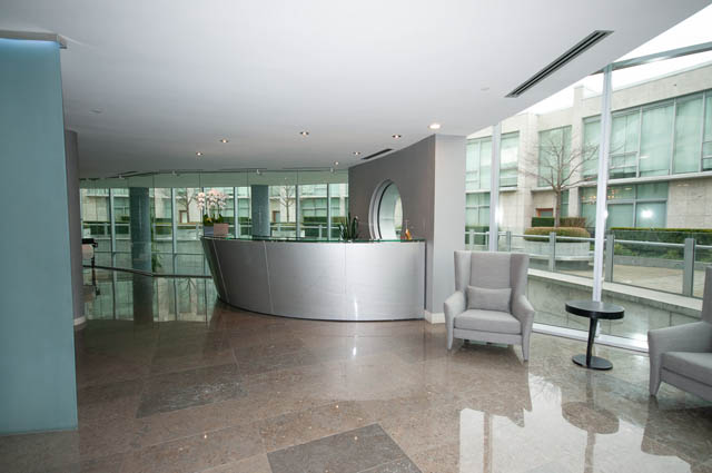 Furnished living room with modern furniture and large windows. - 601 - 1560 Homer Mews, Vancouver Downtown