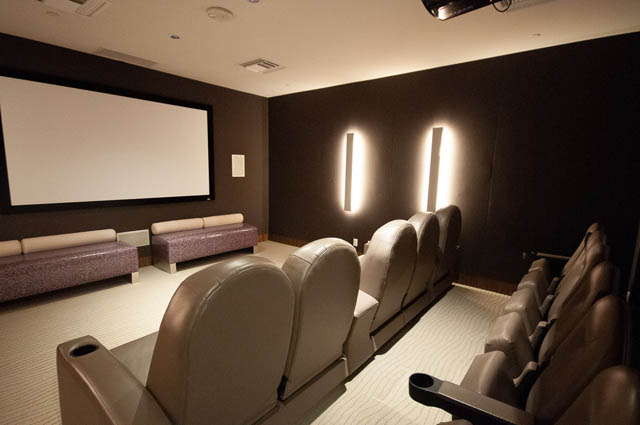 Luxury home theater with plush recliners and large projection screen. - 601 - 1560 Homer Mews, Vancouver Downtown