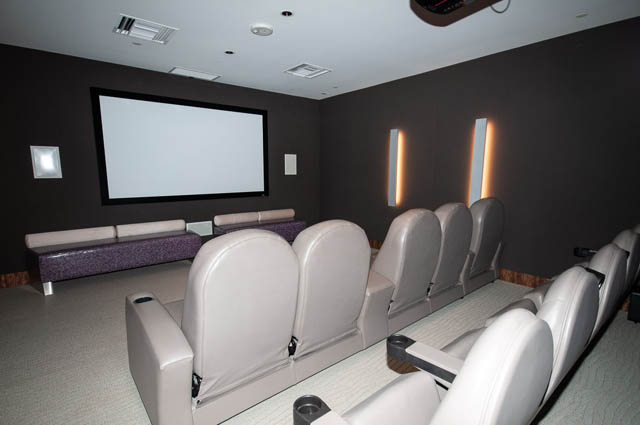 Luxurious home theater with plush seating and modern lighting. - 601 - 1560 Homer Mews, Vancouver Downtown