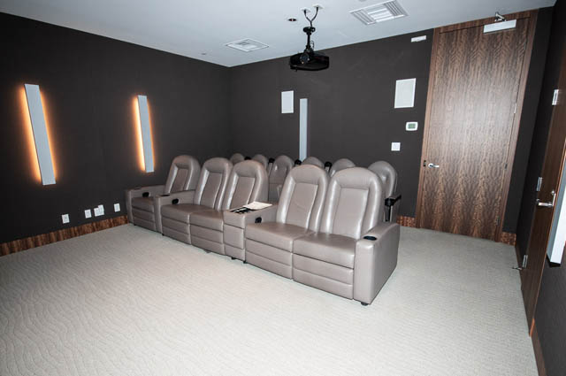 Luxurious home theater with plush recliners and modern lighting. - 601 - 1560 Homer Mews, Vancouver Downtown