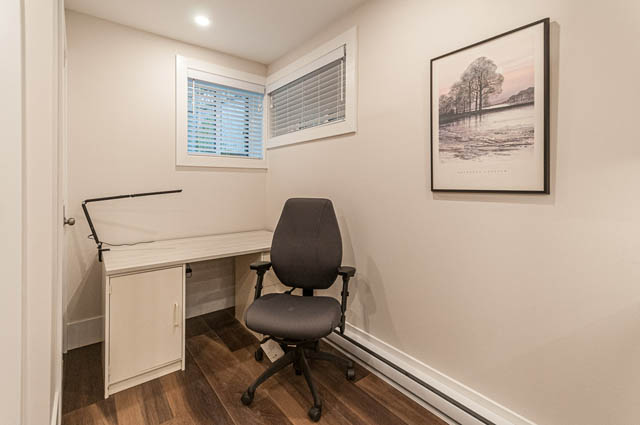 Bright home office with desk, chair, and framed artwork, hardwood floors. - SUITE - 2806 Munday Place, North Vancouver