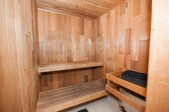 Spacious, well-lit sauna with wooden benches and tiled floor. - 903 -1255 Seymour St, Vancouver Downtown