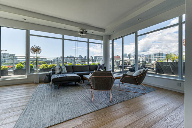 Spacious living room with hardwood floors, city view, and modern furnishings. - 1101 - 1661 Ontario Street, Vancouver West Side