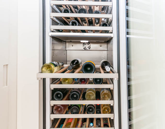 Furnished kitchen with wine storage and glass door. - 1101 - 1661 Ontario Street, Vancouver West Side