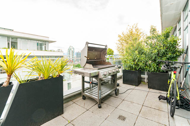 Bright outdoor patio with barbecue grill, potted plants, and city view. - 1101 - 1661 Ontario Street, Vancouver West Side