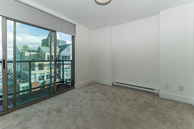 Bright living room with large windows and city view. - 3205 - 928 Richards St, Vancouver Downtown