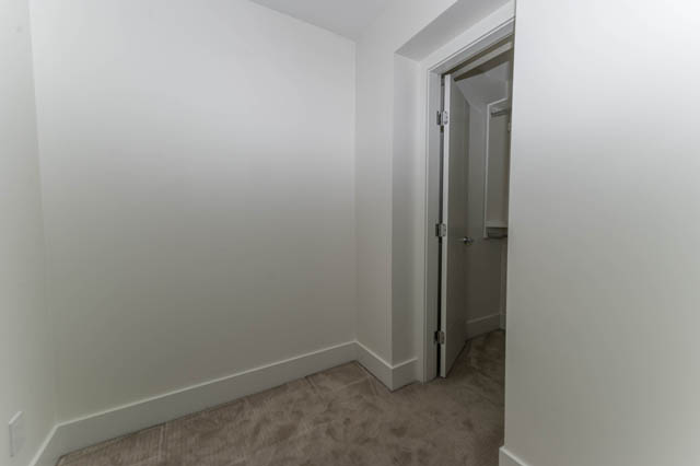 Foyer with tiled floor and white walls leading to another room. - 3205 - 928 Richards St, Vancouver Downtown
